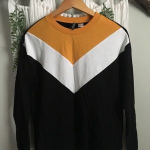 Black, gold, and white geometric sweater